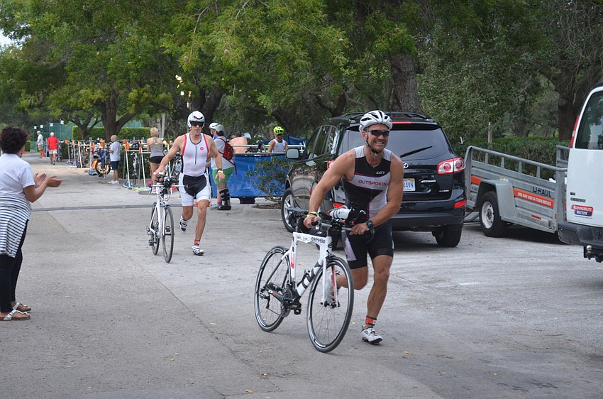 Participants begin the biking portion of the triathlon.