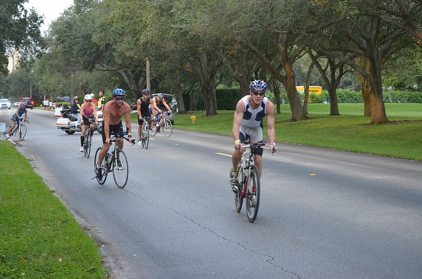Participants begin the biking portion of the triathlon.