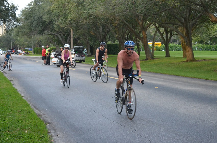 Participants begin the biking portion of the triathlon.