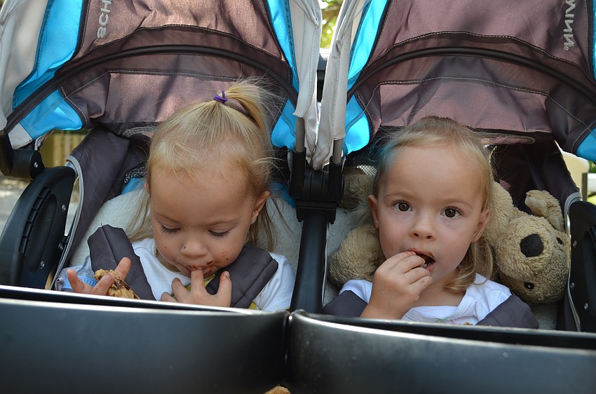 Twin sisters Gaines and Grier Turnbull enjoy chocolate chip cookies.