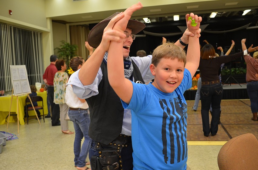 Valarie Smith helps Blaise Lamboley dance to the 