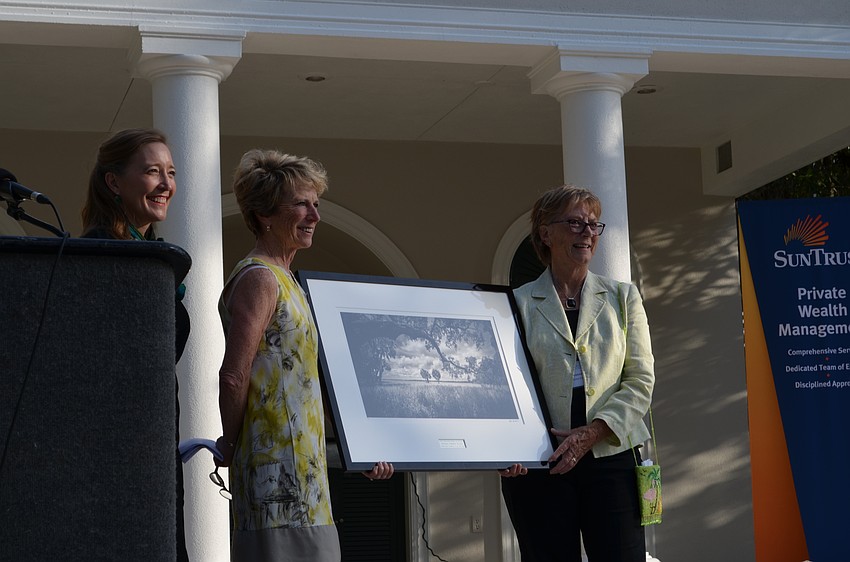 Conservation Foundation President Christine Johnson and Board Chair Eileen Scudder-Zimmermann present Jeanne Dubi with a Partner of the Year award for the Sarasota Audubon Society.