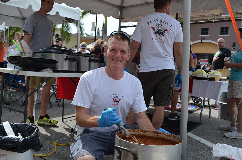Chuck Moonen checks on the chili batch for Southern Manatee Fire Rescue.