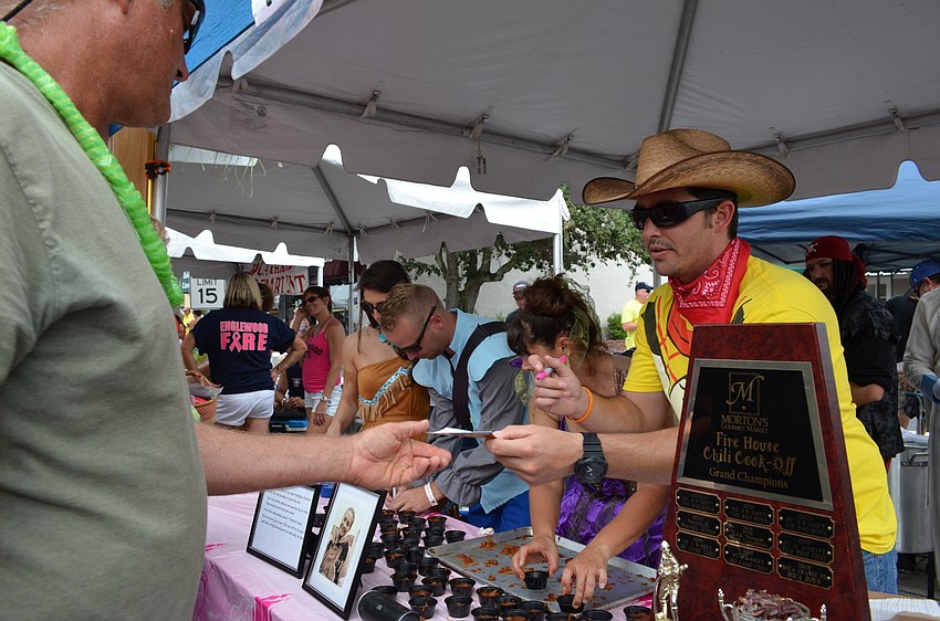 North Port Fire Rescue displays the trophy as the reigning champion for the Morton's Chili Cook Off.