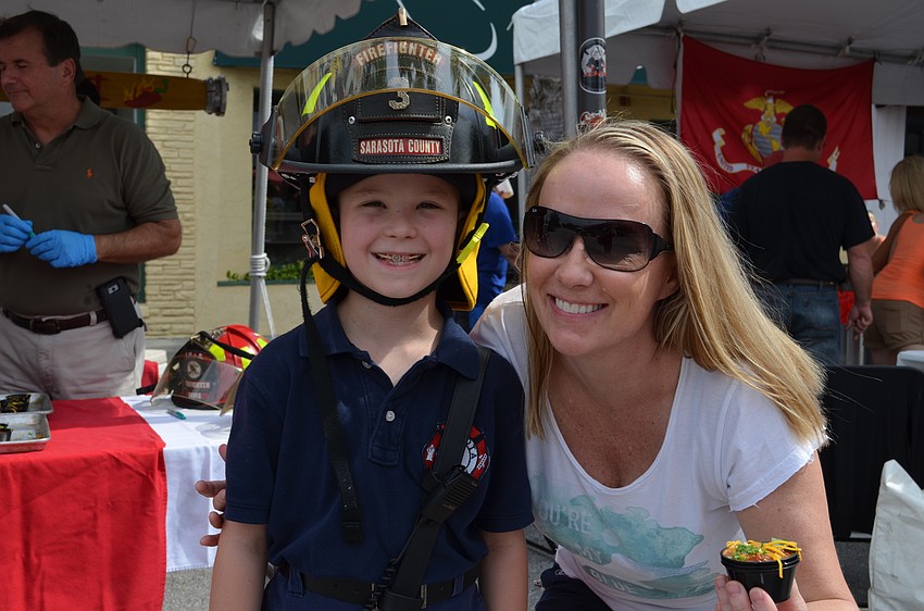 Jake Bolds wears his father's gear with his mother Tricia Bolds.