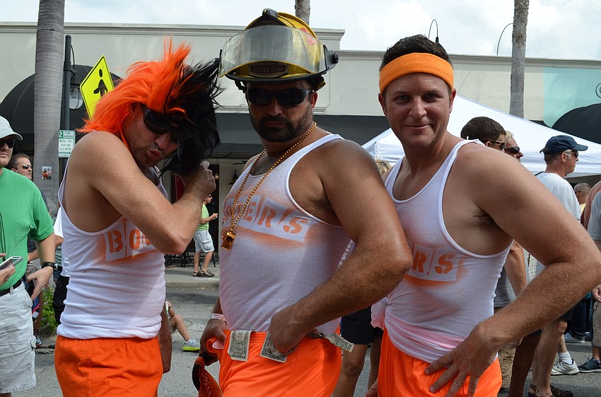 The team from Station 12 did a theme with play on the restaurant Hooters with the name Booters. Justin Ragan, Lt. James Mattera and Andrew Waltrip sport orange shorts and white tank tops.
