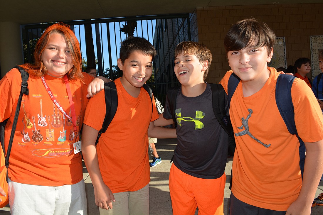 Coy Mahan, Jayden Vilayvong, Nathan Parker and Dylan Martorano sport orange Oct. 21 to offer visible support for the stand against bullying.