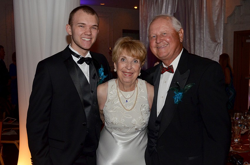 Noah Tye with Jama and Bob Roman