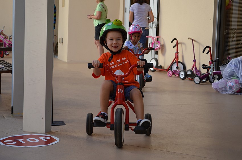 Cal Nykorchuck has a blast riding his tricycle for the Trike-a-thon.