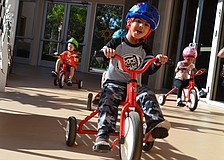 Gurbaj Singh leads the pack of students riding tricycles for The Gan Trike-a-thon Wednesday morning.