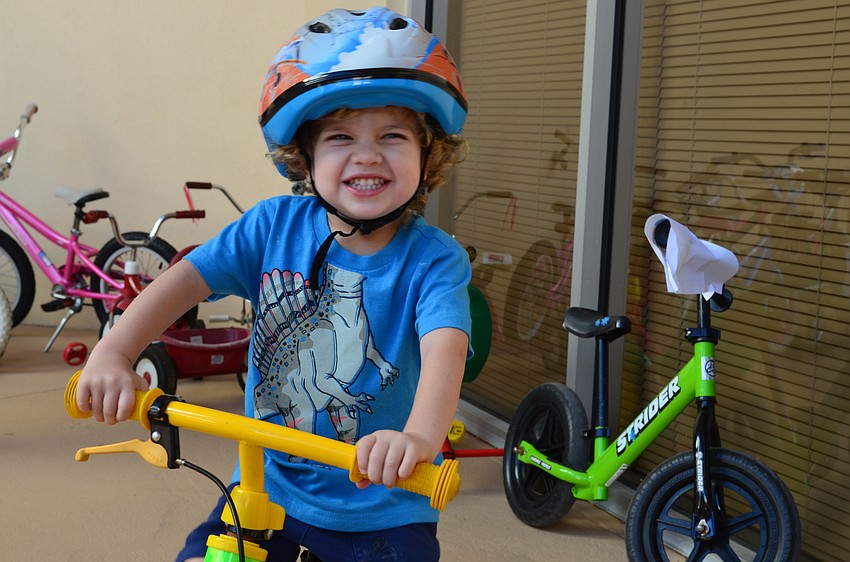 Jett Segal is excited to ride his bike around the track for Trike-a-thon Wednesday morning.