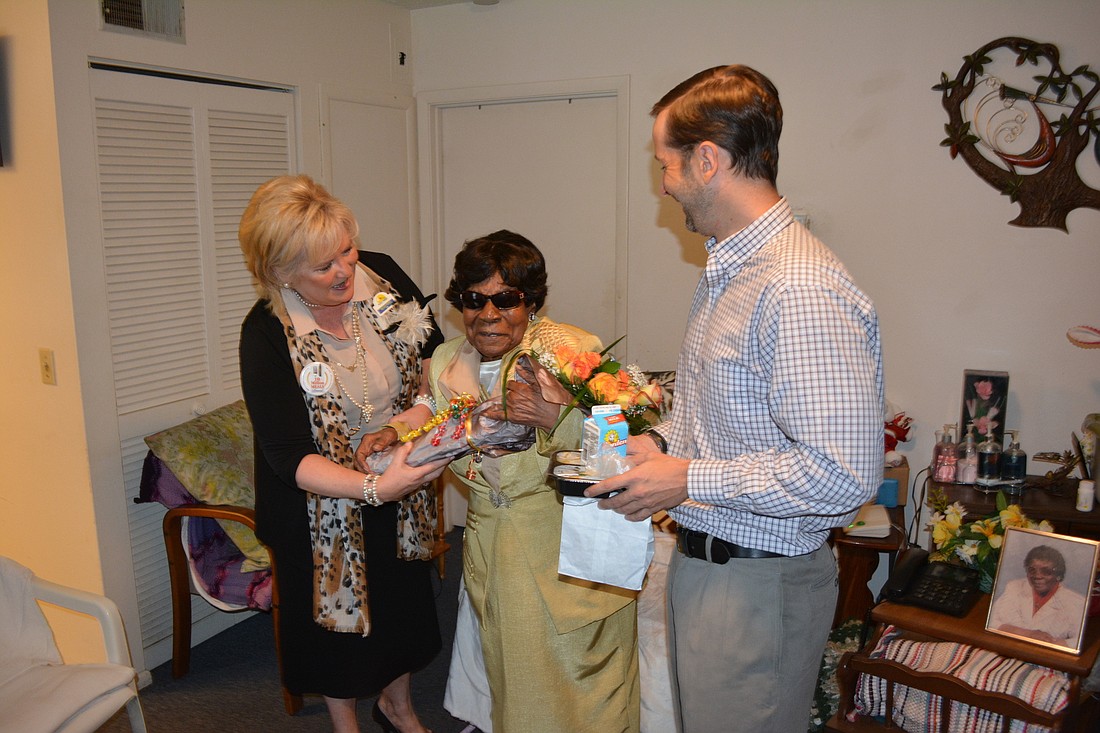 Maribeth Phillips, the Meals on Wheels Plus of Manatee chief executive officer, and Will Robinson, the board chairman, delivered the organization's 10 millionth meal on Thursday to 97-year-old Marie Smith of Bradenton.