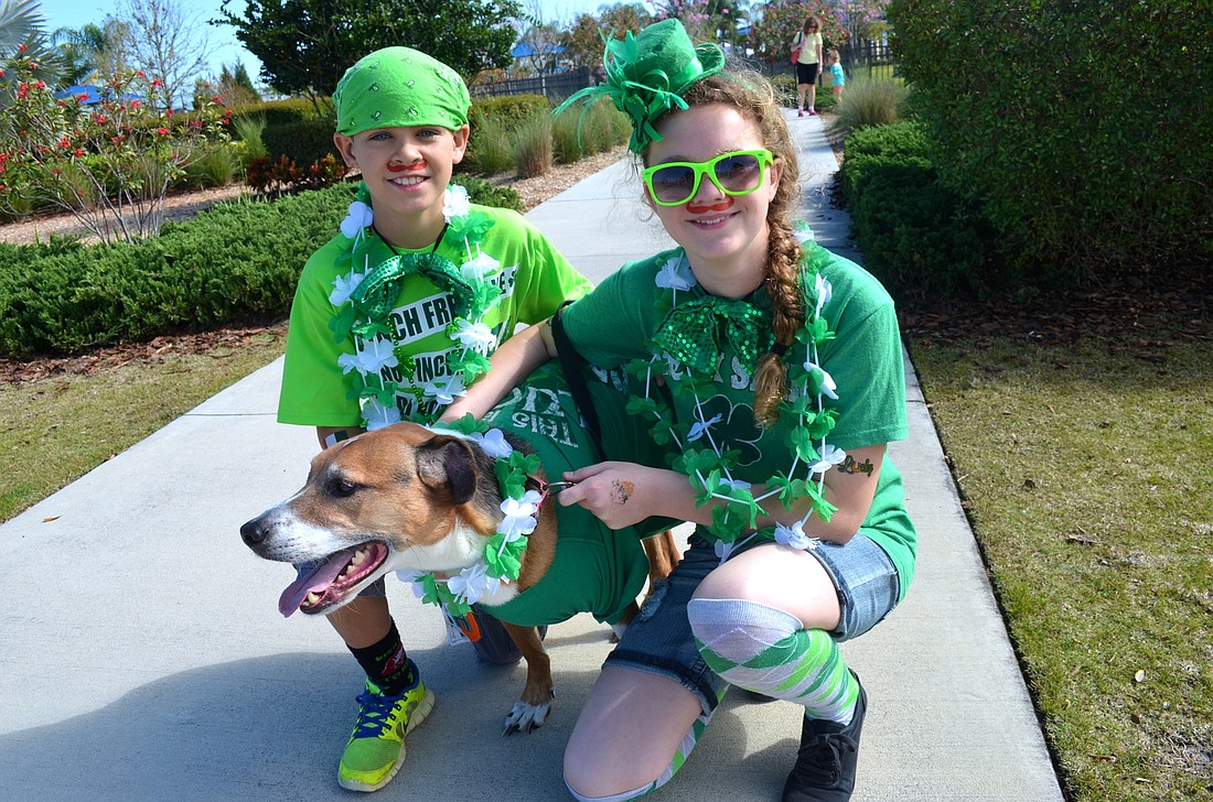 Nathan Parker and Jenna Smith show off their Irish pride alongside 5-year-old Jack.