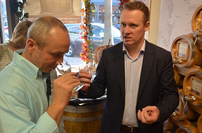 Jerome Sanchez samples some of Teeling's Irish Whiskey.