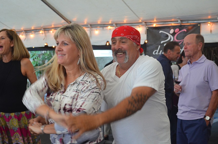 Sharon Bickell and John Hart dance to the music.