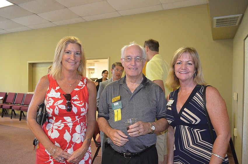 Kim Blakeney, of Jennette Properties, Dennis Hassell, of SMART Merchant Services, and Laurie Francey, of Jennette Properties