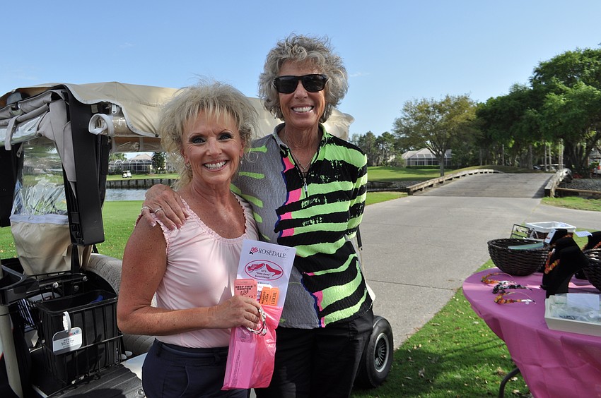 Kate Keegan and Holly O’Shea look at jewelry after some practice shots.