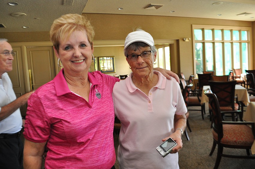 Event chairwoman Verla Heotis poses with event photographer Donna Raynsford.