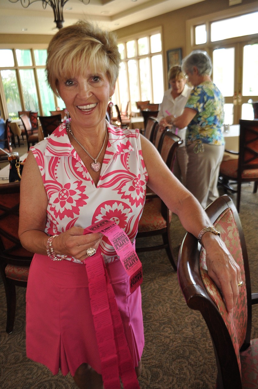 Darlene Hoffman sells raffle tickets for baskets and for a 50/50.