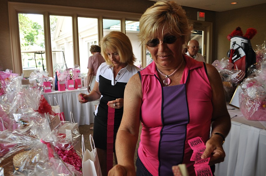 Dee Donegan checks out the raffle items.