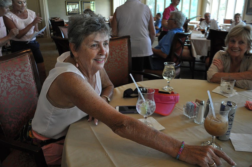 Lyn Roberts chats with friends.