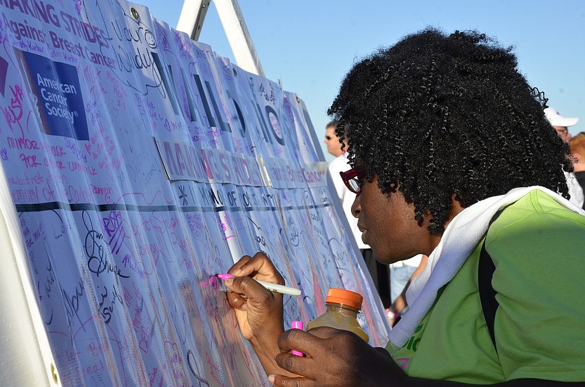 Isabelle Speaks of Bradenton signs the Wall of Hope.