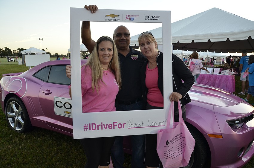 Kim Chevnich and Kim Mucmierz of Sarasota with Juan Palacios with Cox Chevrolet of Bradenton