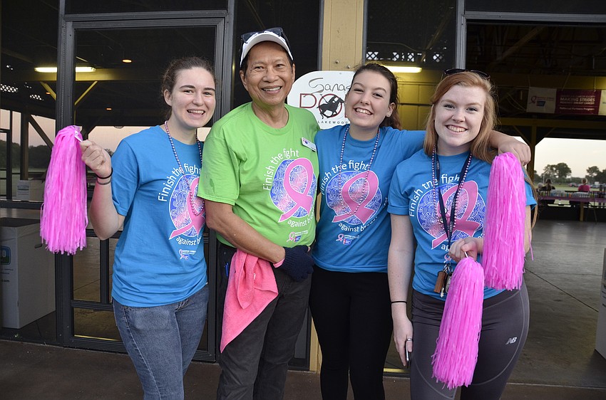 Paige Levanti, Rebekah O'Carroll and Kaley De Leon from Riverview High School are keeping up with a tradition: they take a selfie every year with Fred Lopez, the food and beverage chairman for the walk.