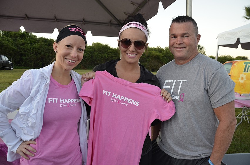 Sunny Rife and Brittany and Danny Hillock with Koko Fit Club lead the morning warm-ups before the walk.