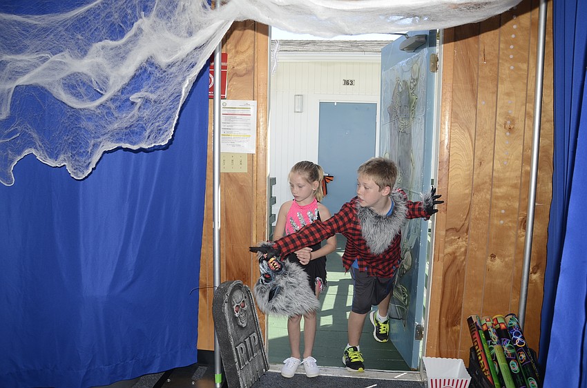 Jakub Dolan shows Addison Stennett the haunted house.