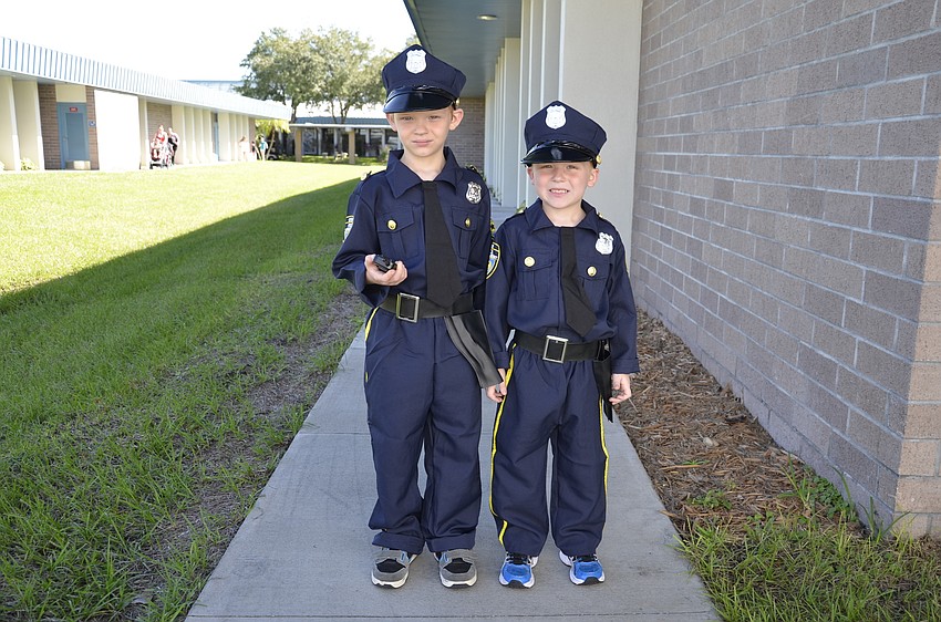 Austin and Aidan Suter dressed up as policemen.
