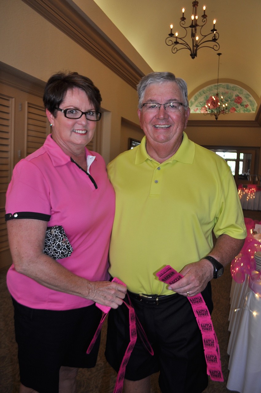Judy and Pat Cline buy a string of raffle tickets.