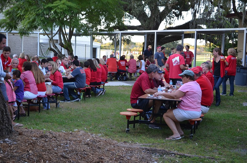 Alumni, families and current students enjoyed a cool Friday evening for the Cardinal Mooney Catholic High School Homecoming Fish Fry.