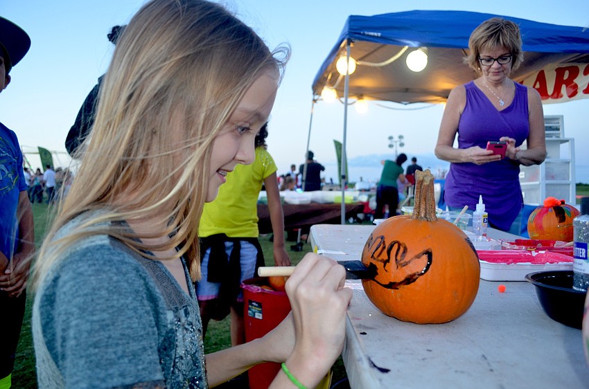 Sydney Graham, of East County, creates a Halloween decoration.