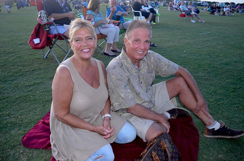 Yolanda and Sal Santangelo, of Rye Wilderness, get cozy and enjoy the show from the lawn.