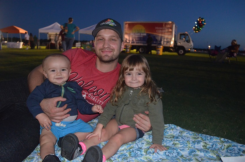 Levi, Derek and Arianna Flaim, of Sarasota, enjoy a family night out.
