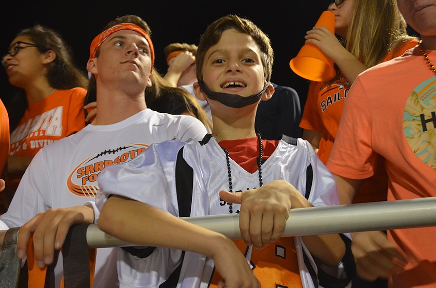 Logan Peachy joined the student section to cheer with friends.