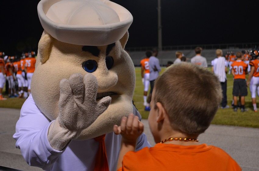Sailor Sam high-fives young fan Matt Loomis.