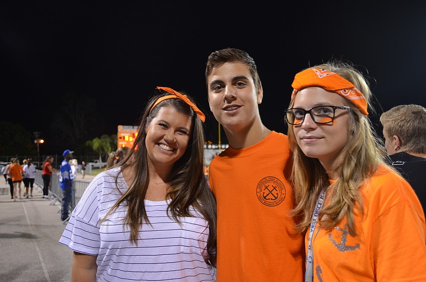 Sarasota High School teacher Taylor Harris with students Josh Yunis and Rose Davis.