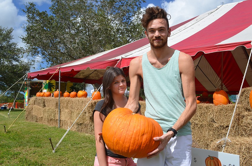 Amber Howey and Emory Evans picked our their pumpkin because it's an odd shape.