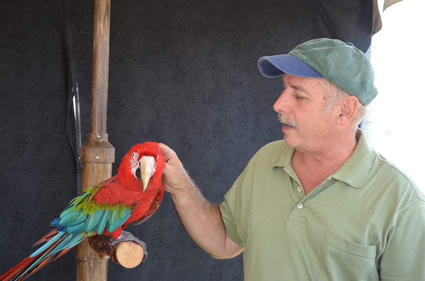 Mark Obark with Sinbad the parrot.