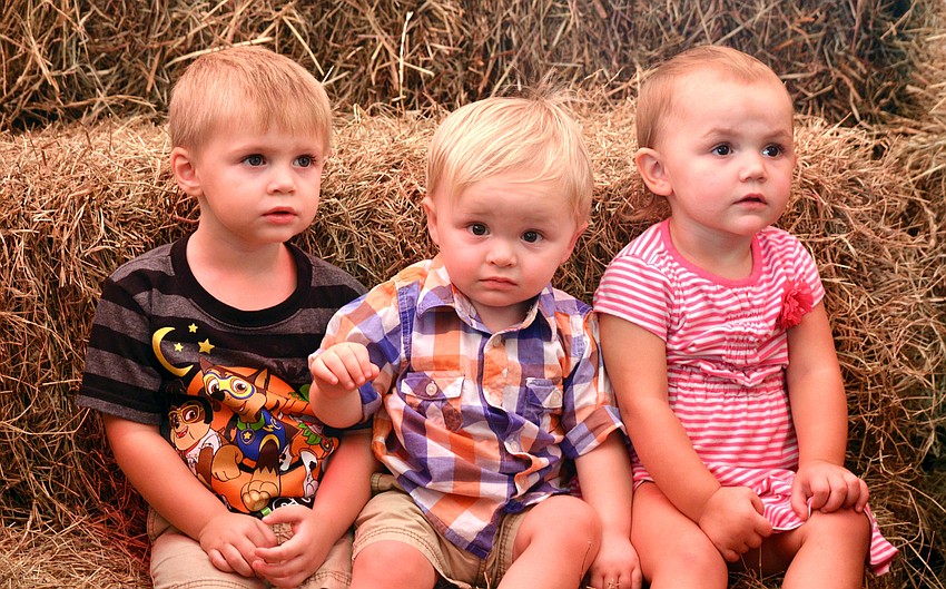 Nolan Harper, Jackson White and Aria Kolb wait patiently to have their photos taken.