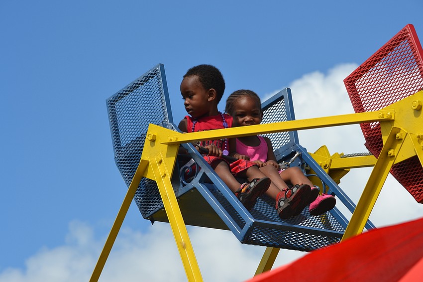 Peanut Brown and his sister Sharierie McDowell enjoy the view from the ferris wheel.