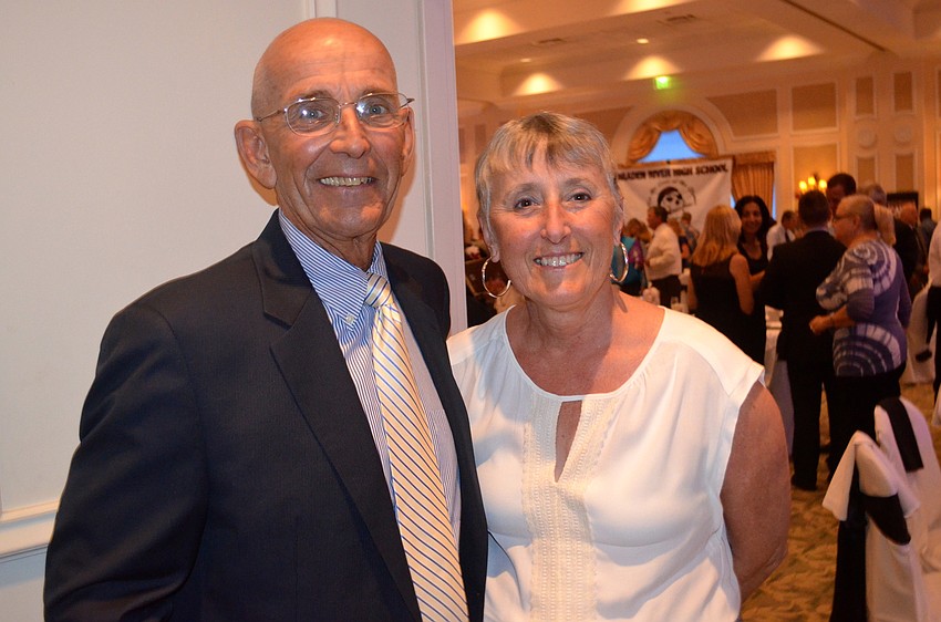 Braden River High's assistant basketball coach Tom McCarthy and his wife, Michelle, find a place in the dining area.