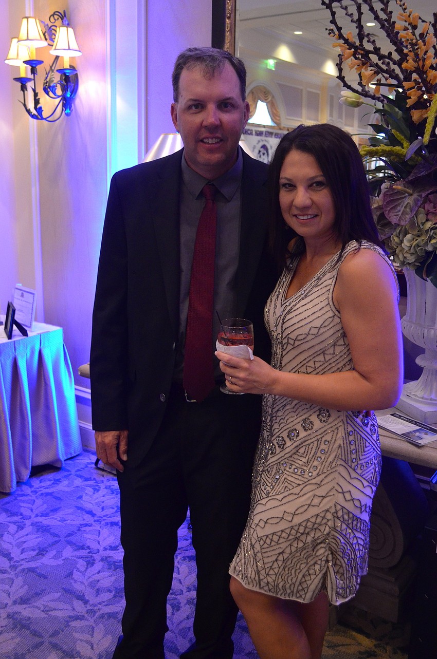 Mike McClrllan and Melissa Gagnon chat near the D.J. booth.