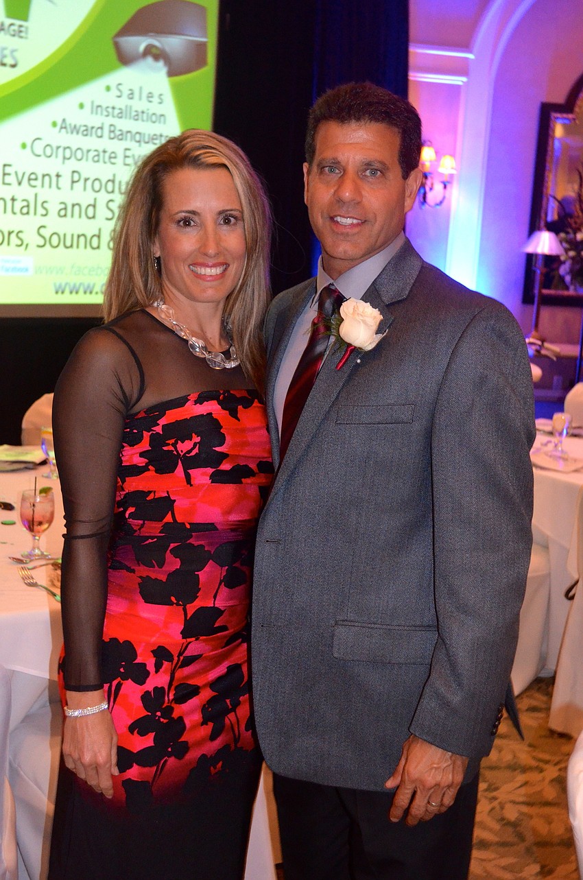 Kristen poses with her husband and Braden River High's Athletic Director, Matt Nesser.