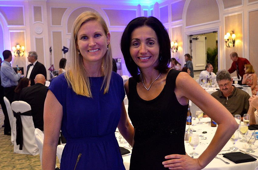 Braden River High coach Abby Toole-Plummer and Braden River parent Lucy Alfonso support their school.