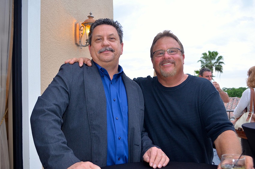 Bob Yursky and Ken Gatschenberger enjoy fresh air on the outdoor pavilion.