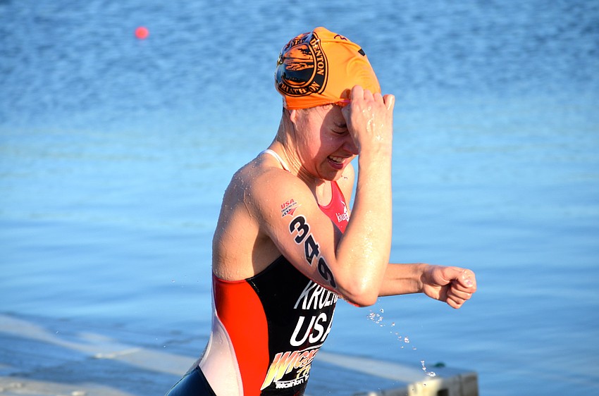 Devon Kroeker pushes her swimming cap to the side and gears up for her next event.