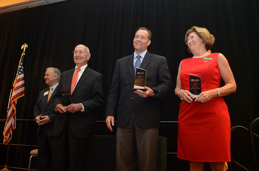 Harry Hobson of Plymouth Harbor on Sarasota Bay awarded Chamber's highest honor, milestone anniversaries of service awards, to the following groups: Williams, Parker, Harrison, Dietz & Getzen; the Herald-Tribune, and Girl Scouts of Southwest Florida.